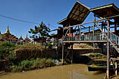 Inle Lake Myanmar. All the buildings are constructed on piles. Residents travel around by canoe, but there are also bamboo walkways and bridges over the canals, monasteries and stupas. 